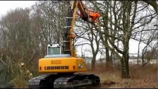 Excavator cutting trees in the woods LIEBHERR 900 clearing land with hydraulic shear [upl. by Nod]