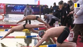 Swimmers brave icy waters in China’s subzero northeast [upl. by Ahsin]