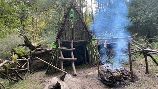 Building Complete And Warm Bushcraft Survival Shelter On A Fallen Trunk Waterproof Hut Fireplace [upl. by Novaelc]