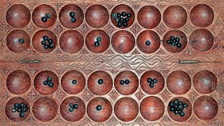 How to play omwesoigisoro African mancala game [upl. by Kaine173]