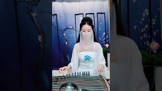 Traditional Chinese girl playing guzheng aka Chinese zither [upl. by O'Mahony]