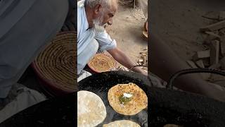 Hardworking old man selling parathas with saag and makhan in Lahore [upl. by Deloria]