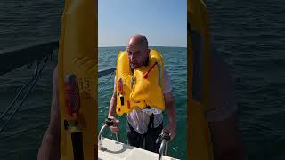 How do life jackets work when you fall overboard lifesavers lifehack boatlife [upl. by Ahtanaram915]