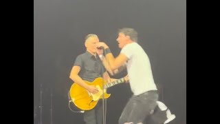 WATCH Fan leaps on stage at Bryan Adams concert to steal mic during Summer of 69 [upl. by Acirretahs341]