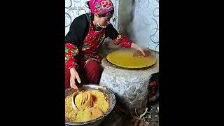 Auntie making mixed grains pancakes on a woodburning earthen stove [upl. by Aerol785]