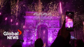 New Years 2023 Paris France gets the party started with fireworks smoke show over Arc de Triomphe [upl. by Llennoc485]