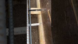 Setting up for weep holes in a little retaining wall forming framing concrete tradesmen [upl. by Onstad]