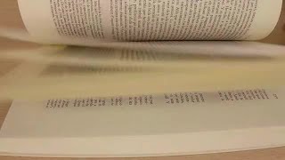 Flipping Through Book Pages Stock Video [upl. by Nylasoj483]