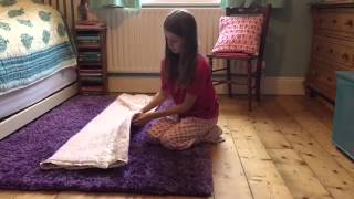 How to Fold a Quillow  Natural Quilts [upl. by Ahsinut]