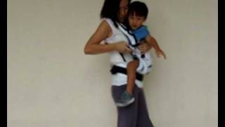 Manduca Baby Carrier Instructions  Switching from Side Carry to Front Carry Position [upl. by Schurman]