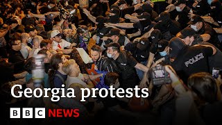 Georgia Protesters hit by police water cannons after passing of Russian inspired bill  BBC News [upl. by Skantze777]