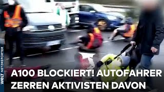 A100 IN BERLIN Aktivisten blockieren Stadtautobahn  Autofahrer zerren sie von der Straße [upl. by Faye]