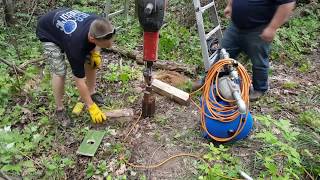 Driving a sandpoint well with a jackhammer [upl. by Tingley600]