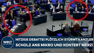 BUNDESTAG Hitzige Debatte Plötzlich stürmt Kanzler Olaf Scholz zum Mikro  und kontert Merz [upl. by Llecrad69]