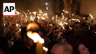 Eastern Orthodox worshippers throng Holy Fire ceremony in Jerusalem [upl. by Sirtimid]