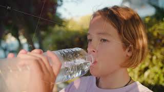 Teen drinking water on city street [upl. by Demmahum66]