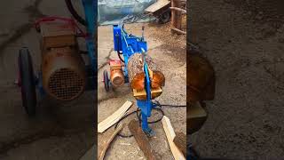 The process of splitting firewood with a wood splitter [upl. by Atinomar]