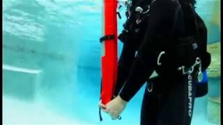 Scuba Skill  How to Deploy an Inflatable Signaling device [upl. by Pattison522]