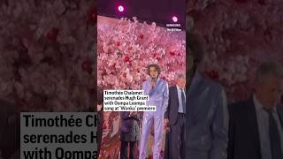 Timothée Chalamet serenades Hugh Grant with Oompa Loompa song at ‘Wonka’ premiere [upl. by Avilys]